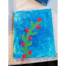 Téglalap festővászonra festett kitapintható kaktusz virág, törzse zöld a virága pedig piros. 