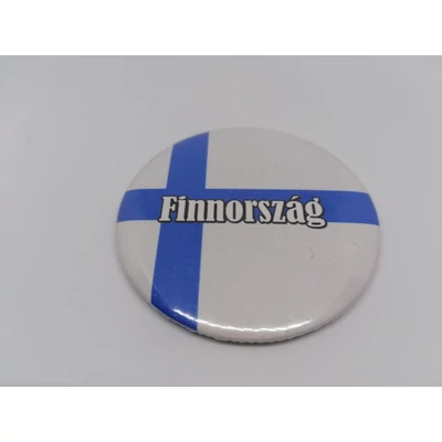 Köralakú hűtőmágnes zászlóval, fehér Finnország felirattal.
